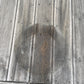 Circular mark on wooden decking after a pot has been moved